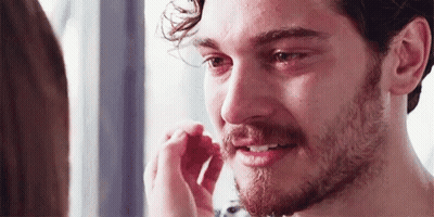 Bearded Man Crying While Woman Touches His Nose GIF