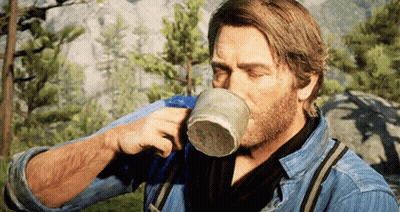 Bearded Man Drinking From Cup In Woods GIF