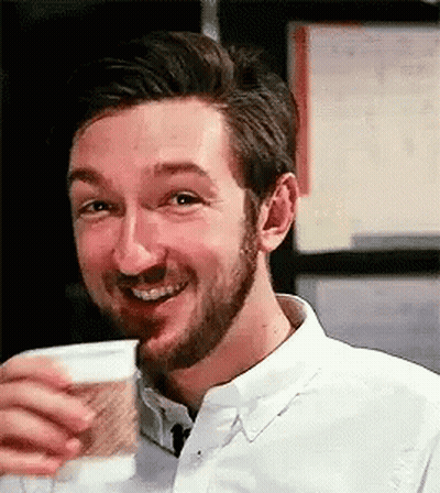 Bearded Man Drinking From Cup Smiling GIF