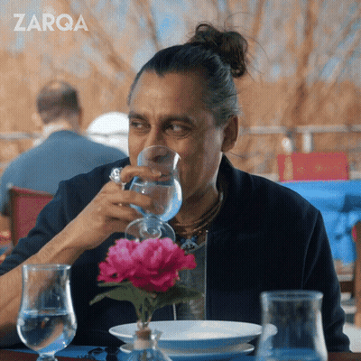 Bearded Man Drinking From Red Mug GIF