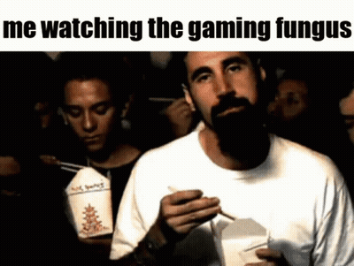Bearded Man Eating Chinese Food While Watching Video Game GIF