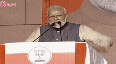 Bearded Man Giving Speech With Microphone In Mouth At Podium GIF