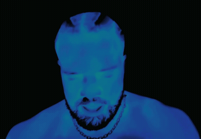 Bearded Man Glowing In Darkness GIF