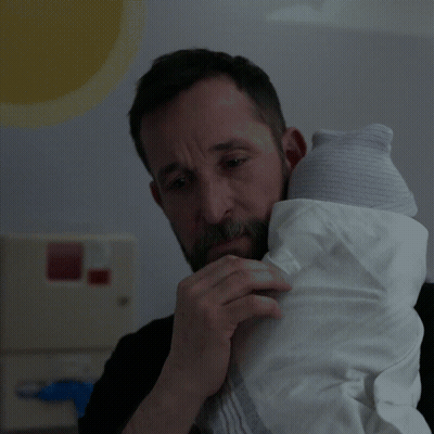 Bearded Man Holding Baby In White Blanket GIF