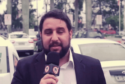 Bearded Man Holding BD Microphone GIF