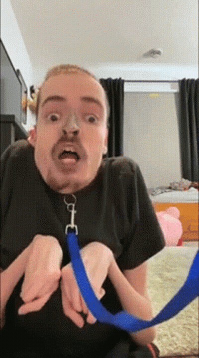Bearded Man Holding Blue Leash GIF