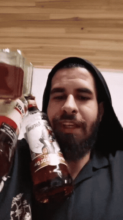 Bearded Man Holding Bordo Bottle GIF
