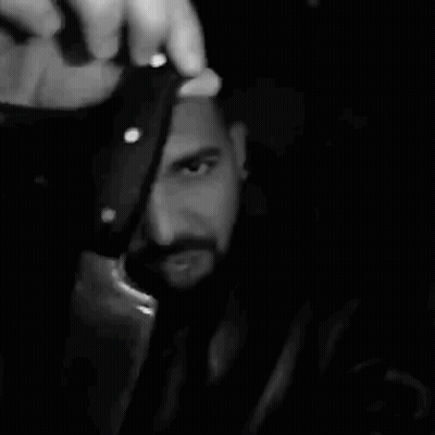 Bearded Man Holding Bottle GIF