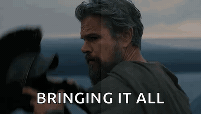Bearded Man Holding Camera In Front Of Water GIF