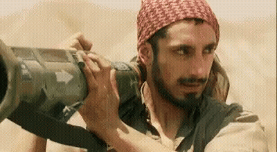 Bearded Man Holding Cannon GIF