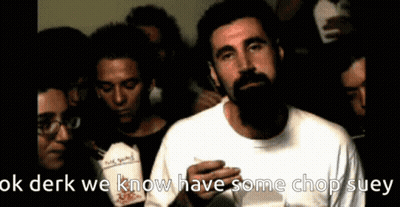 Bearded Man Holding Chop Suey In Front Of Group GIF