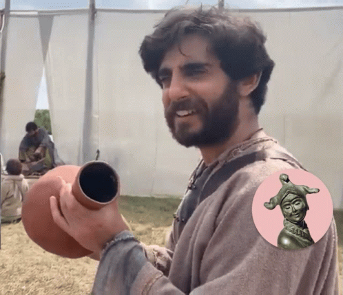 Bearded Man Holding Clay Pot GIF