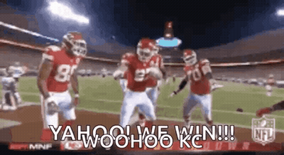 Bearded Man Holding Football In Front Of Jerseys GIF