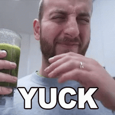 Bearded Man Holding Green Juice Saying Yuck GIF