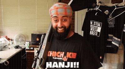 Bearded Man Holding Gun In High Kie Shirt GIF