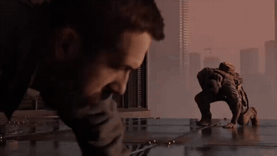Bearded Man Holding Gun With Price On Jacket GIF