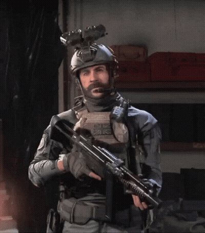 Bearded Man Holding Gun With UK Helmet GIF