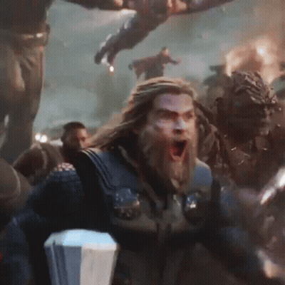 Bearded Man Holding Hammer In Crowd GIF