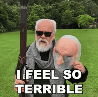 Bearded Man Holding I Feel So Terrible Mask GIF