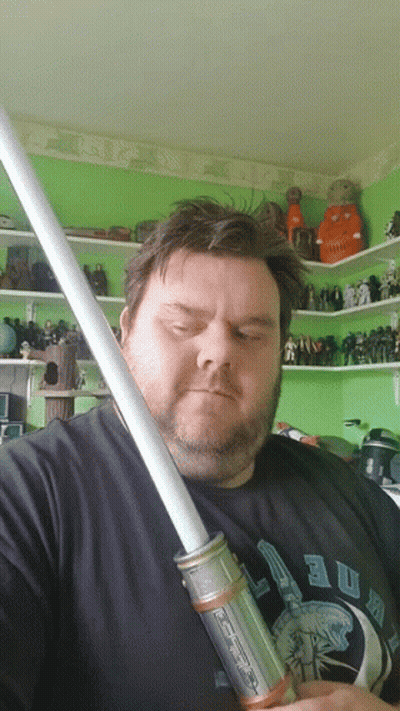 Bearded Man Holding Light Saber GIF