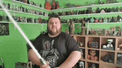 Bearded Man Holding Lightsaber GIF