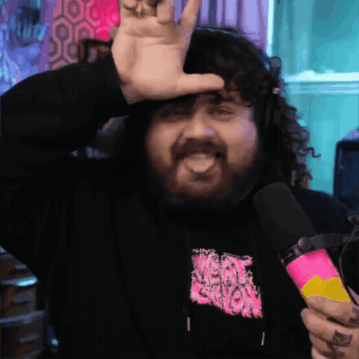 Bearded Man Holding Microphone And Making Devil Horns GIF