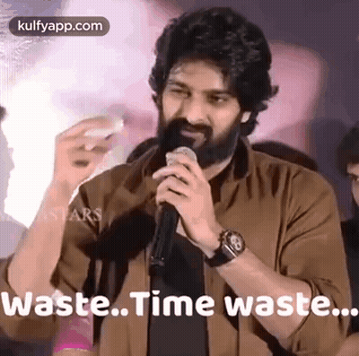 Bearded Man Holding Microphone Saying Waste Time Waste GIF