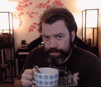 Bearded Man Holding Mug Saying Rock GIF