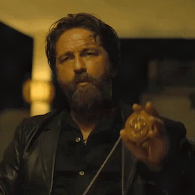 Bearded Man Holding Number 10 Coin GIF