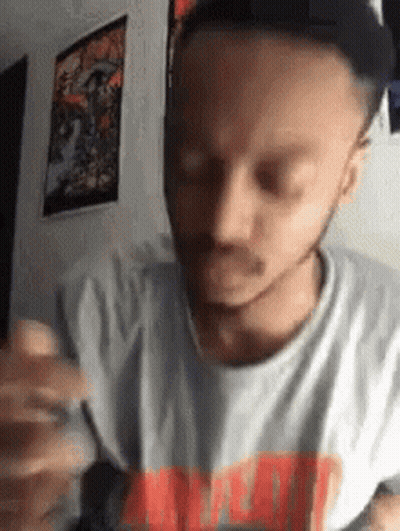 Bearded Man Holding Pen Making Face GIF