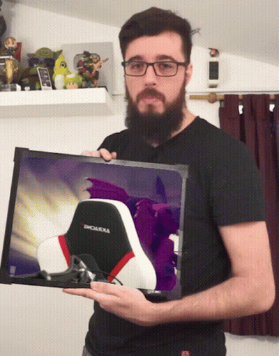 Bearded Man Holding Picture Of Chair Saying Emoluxia GIF