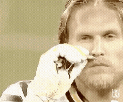 Bearded Man Holding Scissors In Front Of Face GIF