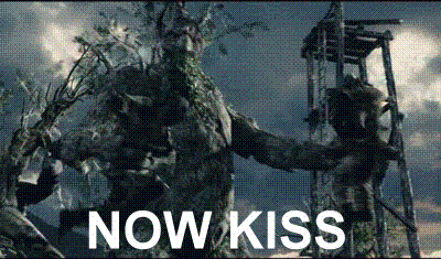 Bearded Man Holding Statue Saying Now Kiss GIF