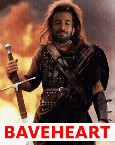 Bearded Man Holding Sword In Front Of Fire Braveheart GIF