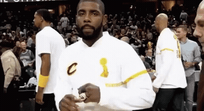 Bearded Man Holding Trophy On Basketball Court GIF
