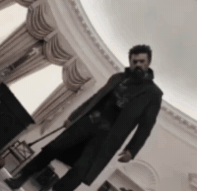 Bearded Man Holding Wand GIF