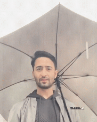 Bearded Man Holding White Umbrella GIF