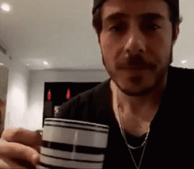 Bearded Man Holding Wine Glass GIF