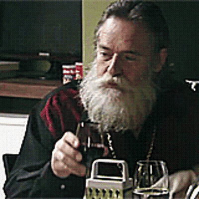 Bearded Man Holding Wine Glass GIF