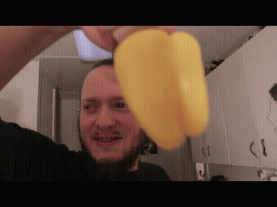 Bearded Man Holding Yellow Pepper GIF