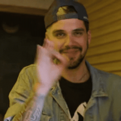 Bearded Man In Baseball Cap And Denim Jacket Thumbs Up GIF