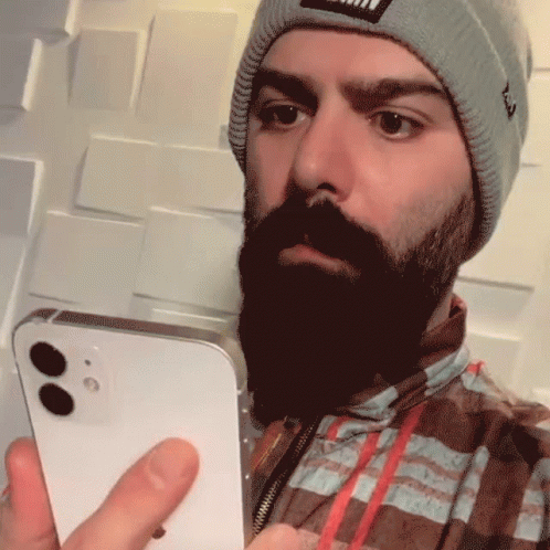 Bearded Man In Beanie Holding Cellphone GIF