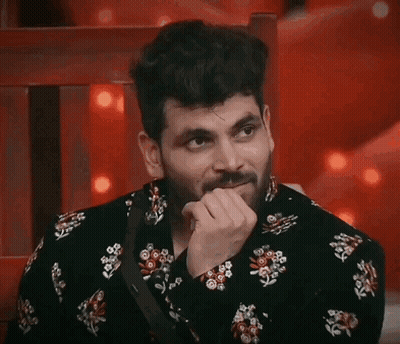 Bearded Man In Black Floral Shirt Hand On Chin GIF