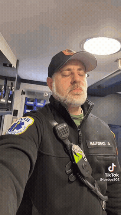 Bearded Man In Black Jacket And Hat With EMT Patch GIF