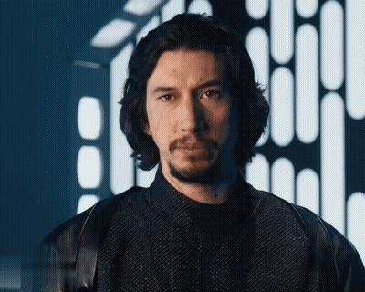 Bearded Man In Black Jacket Looking At Camera GIF