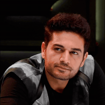 Bearded Man In Black Shirt And Leather Vest GIF