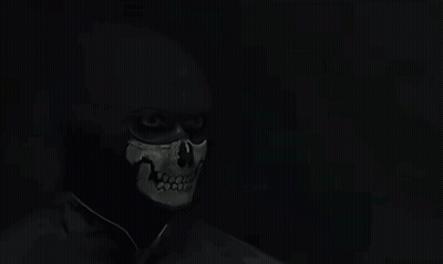Bearded Man In Black Shirt In Dark GIF