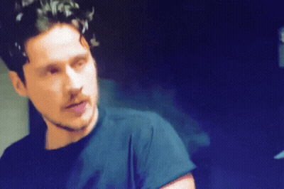 Bearded Man In Black Shirt Looking GIF