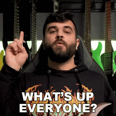 Bearded Man In Black Shirt Saying What's Up Everyone GIF