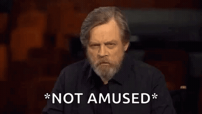 Bearded Man In Black Shirt Says Not Amused GIF